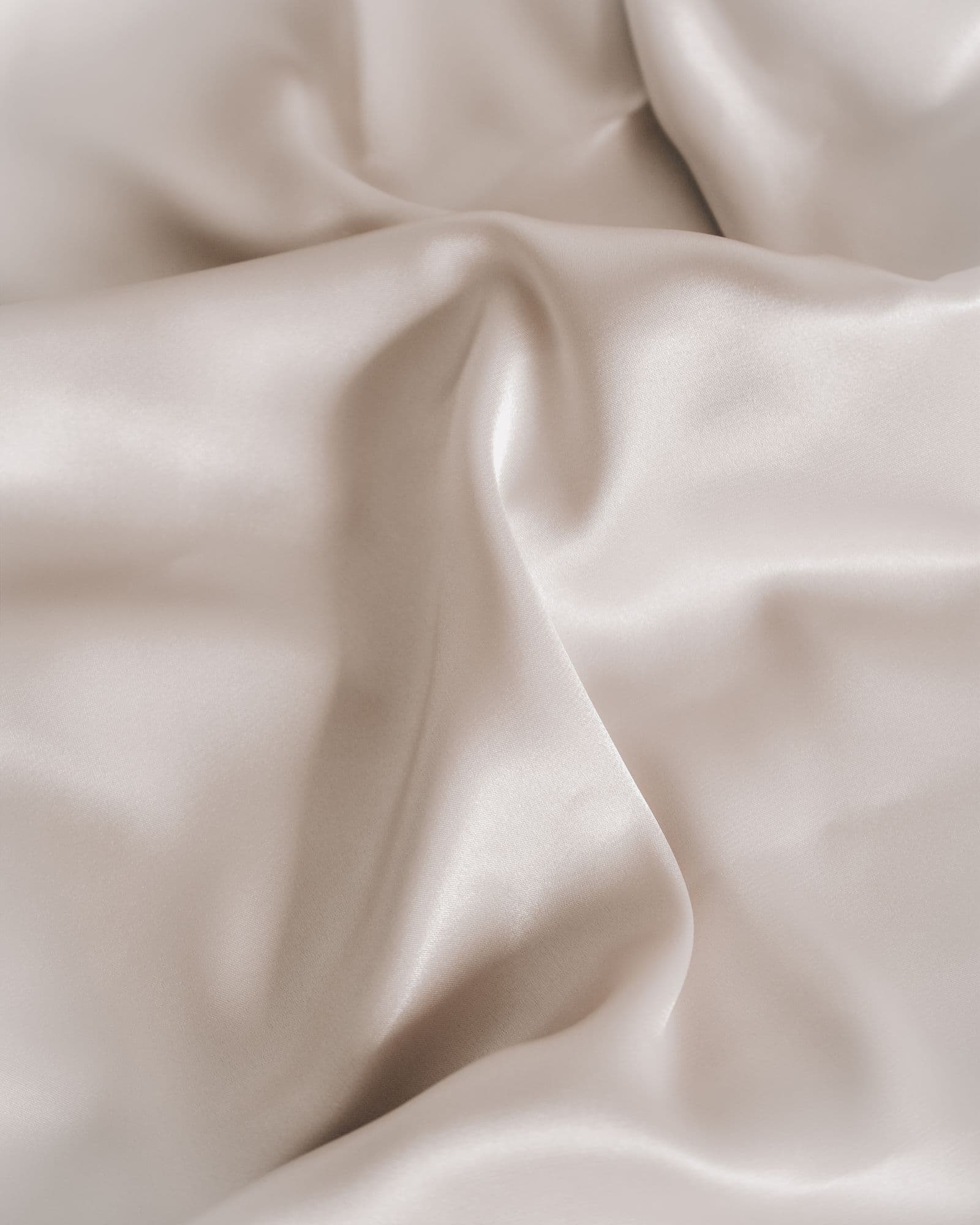 Close-up of soft, breathable white bamboo bedding texture