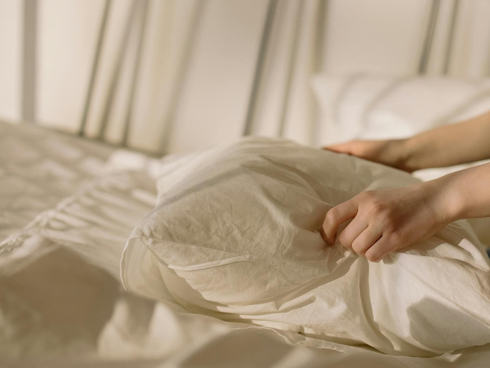 Neatly folded crisp white bamboo bed linens