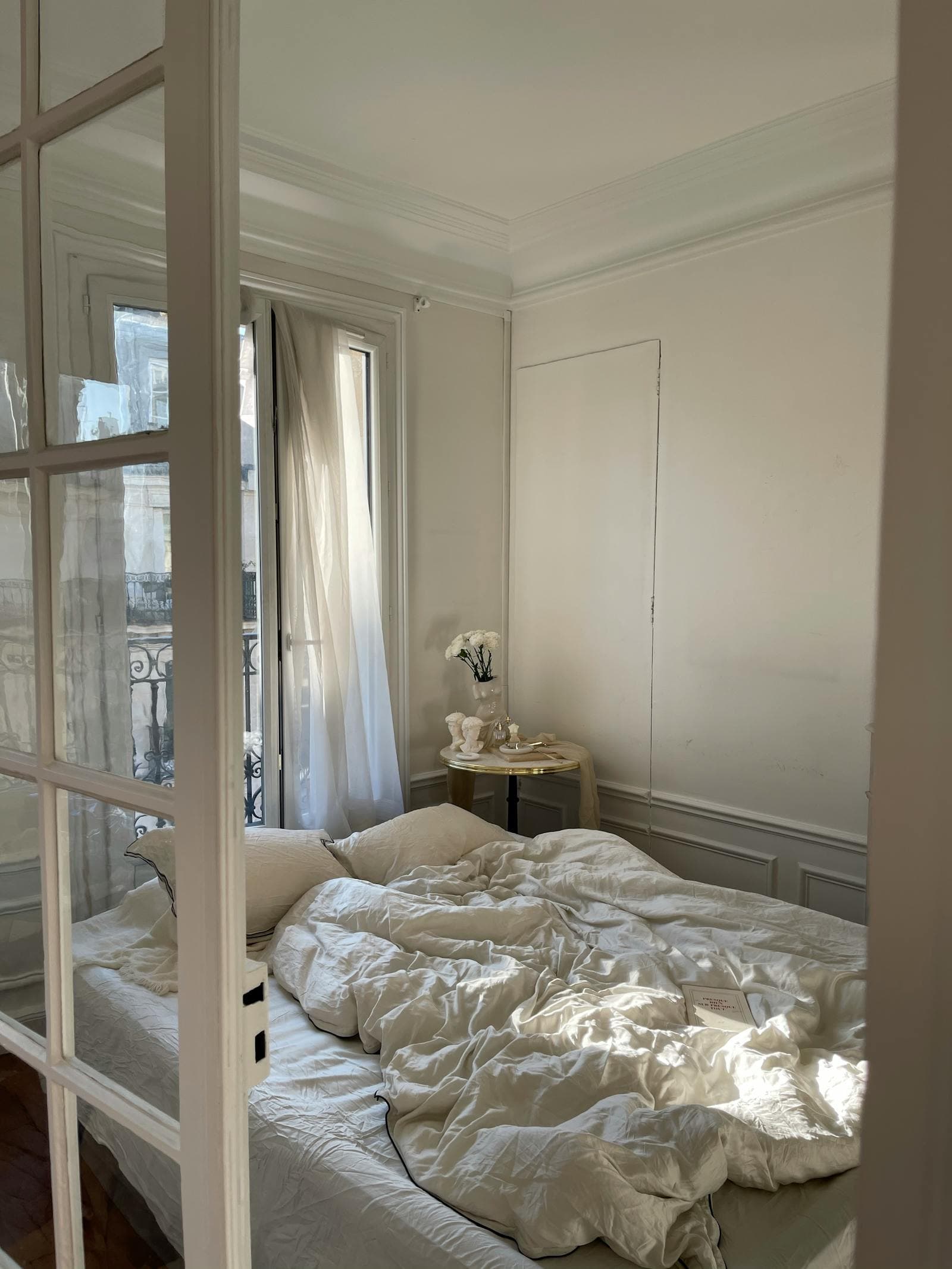 Sunlit bedroom with white bamboo bedding